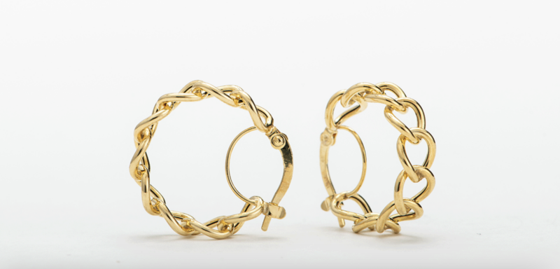 A pair of gold hoops on a white background.